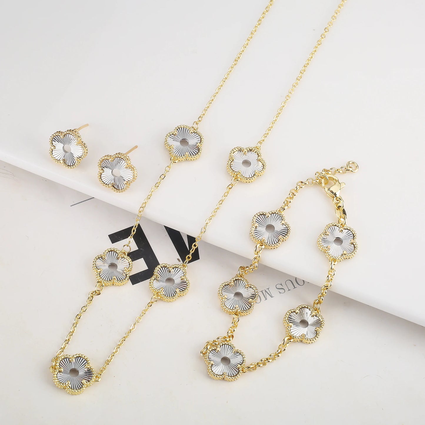 Hollow Metal Double sided Hollow Jewelry Set Sparkling Hot Selling Plum Blossom Jewelry Set Creative New Design For Women Clover