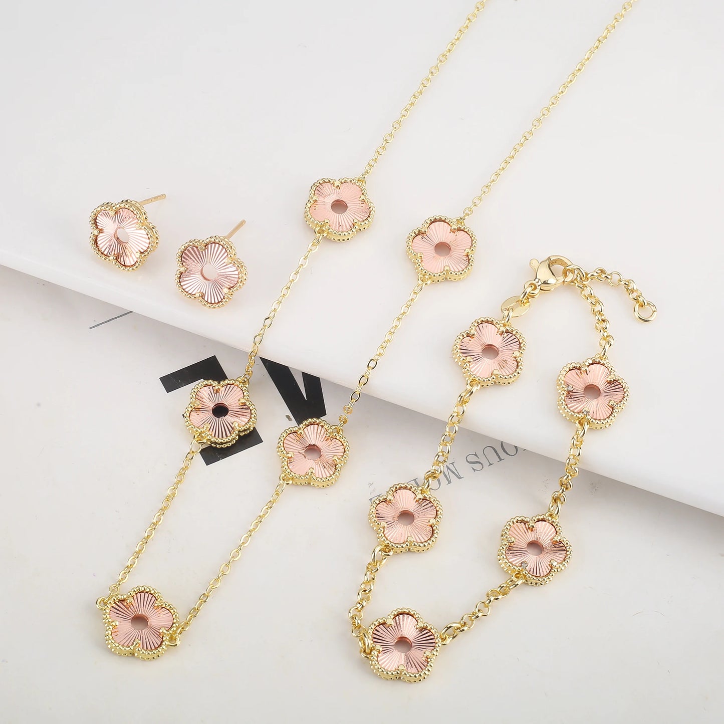 Hollow Metal Double sided Hollow Jewelry Set Sparkling Hot Selling Plum Blossom Jewelry Set Creative New Design For Women Clover