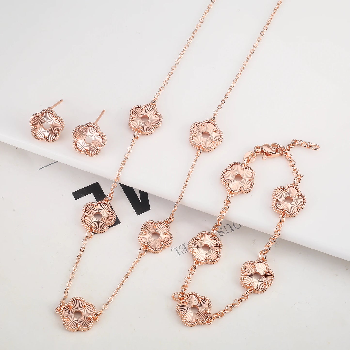 Hollow Metal Double sided Hollow Jewelry Set Sparkling Hot Selling Plum Blossom Jewelry Set Creative New Design For Women Clover
