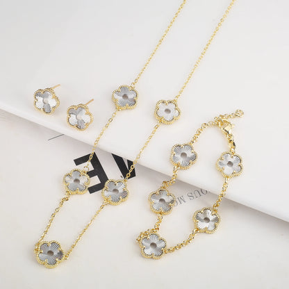 Hollow Metal Double sided Hollow Jewelry Set Sparkling Hot Selling Plum Blossom Jewelry Set Creative New Design For Women Clover