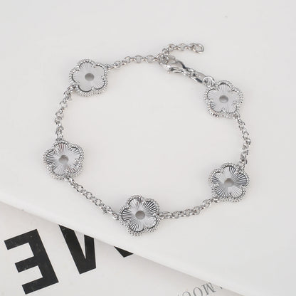 Hollow Metal Double sided Hollow Jewelry Set Sparkling Hot Selling Plum Blossom Jewelry Set Creative New Design For Women Clover